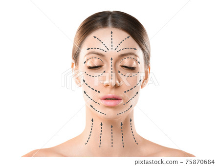 Beautiful caucasian female face with closed eyes and hair up in a bun. Skin marked with black arrows on the main facial lifting lines, front view, isolated on white. 75870684