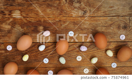 Eggs on a wooden rustic background with copy space for text. 75874961