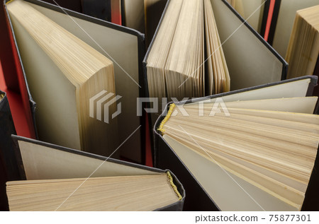 Composition with vintage old hardback books  on  red background. Books open. Back to school.  Education background. 75877301