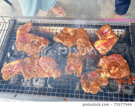 Marinated mutton with spices, grilled and smoked using controlled charcoal fire. 75877944