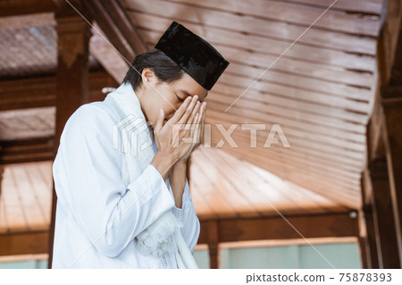 Muslim man worships and prays for Allah in Muslim man worships and prays for Allah in 75878393