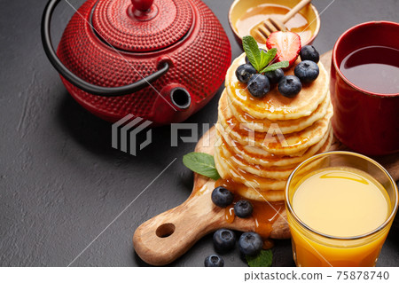 Healthy breakfast with pancakes and herbal tea 75878740