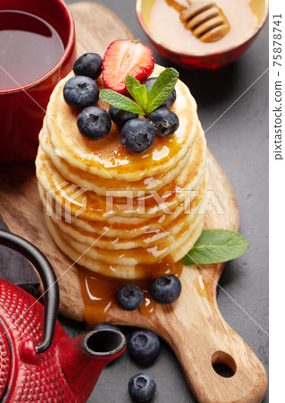 Healthy breakfast with pancakes and herbal tea Healthy breakfast with pancakes and herbal tea 75878741