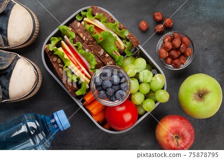 Healthy school lunch box with sandwich and fresh vegetables Healthy school lunch box with sandwich and fresh vegetables 75878795
