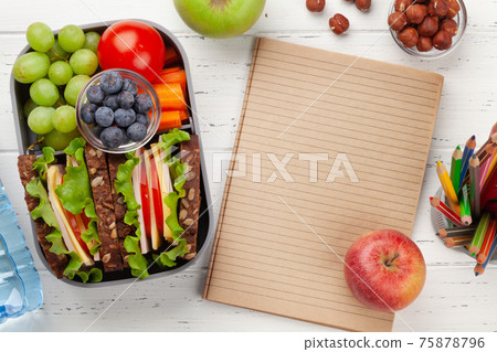 Healthy school lunch box with sandwich and fresh vegetables Healthy school lunch box with sandwich and fresh vegetables 75878796