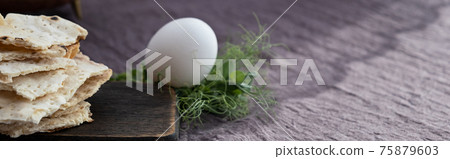Homemade matzo with microgreen peas. Unleavened flatbread bread. Pesah celebration concept. Jewish Passover background. Pita. 75879603