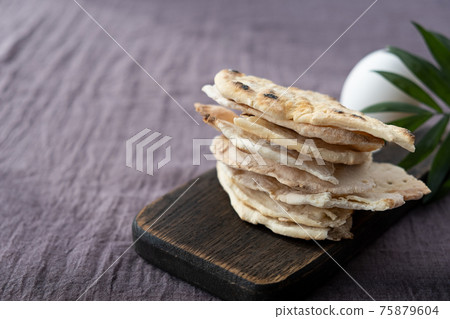 Homemade matzo with microgreen peas. Unleavened flatbread bread. Pesah celebration concept. Jewish Passover background. Pita. 75879604