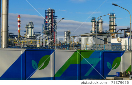 Corps of Moscow refinery in spring in clear weather 75879656