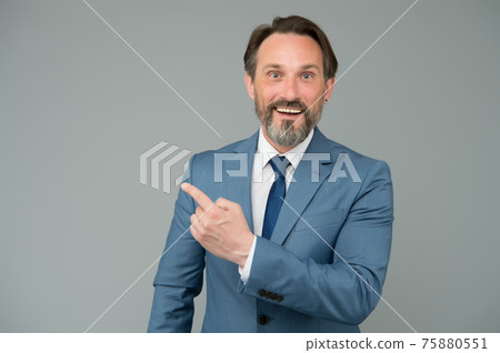 Businessman smiling mature man pointing copy space, promoting services concept Businessman smiling mature man pointing copy space, promoting services concept 75880551