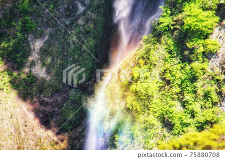 A landscape of Shindou Falls shining in rainbow colors illuminated by sunlight 75880708