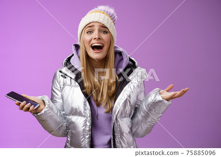 Girl upset yelling explaining missing chance lifetime feel regret speaking passionately spread hands sideways holding smartphone look bothered disappointed, standing purple background Girl upset yelling explaining missing chance lifetime feel regret speaking passionately spread hands sideways holding smartphone look bothered disappointed, standing purple background 75885096