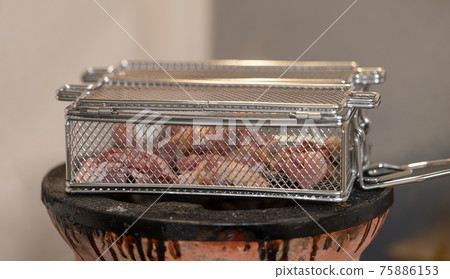 Charcoal grilling of chicken Charcoal grilling of chicken 75886153