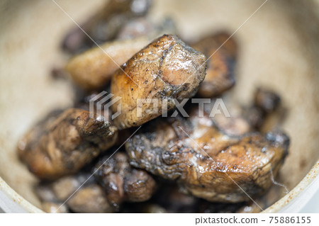 Charcoal grilling of chicken 75886155