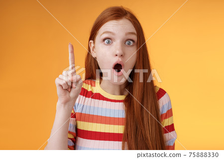 Wow got excellent idea. Excited shocked redhead girl open mouth raise index finger eureka gesture stare camera thrilled adding suggestion have plan think-up solution, standing orange background Wow got excellent idea. Excited shocked redhead girl open mouth raise index finger eureka gesture stare camera thrilled adding suggestion have plan think-up solution, standing orange background 75888330