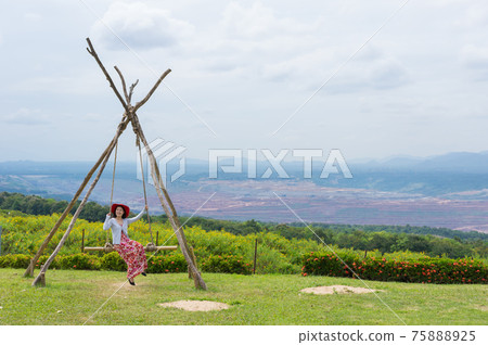 women happy playing swing. women happy playing swing. 75888925