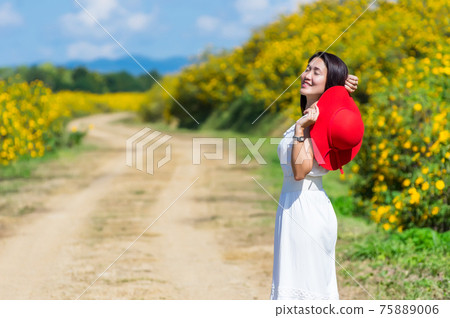 Beautiful woman in nature flower. Beautiful woman in nature flower. 75889006