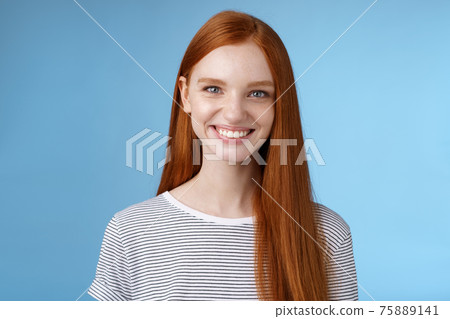 Pleasant reliable sincere good-looking redhead female freelancer college student make confident professional impression smiling broadly assertive helpful standing blue background self-assured Pleasant reliable sincere good-looking redhead female freelancer college student make confident professional impression smiling broadly assertive helpful standing blue background self-assured 75889141
