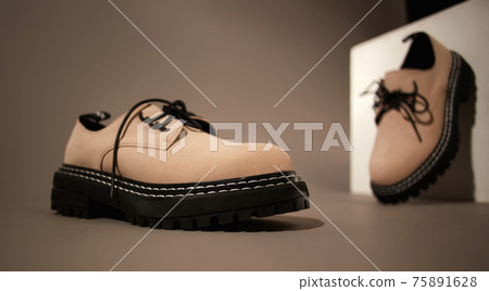 beige boots. fashion shoes still life beige boots. fashion shoes still life 75891628