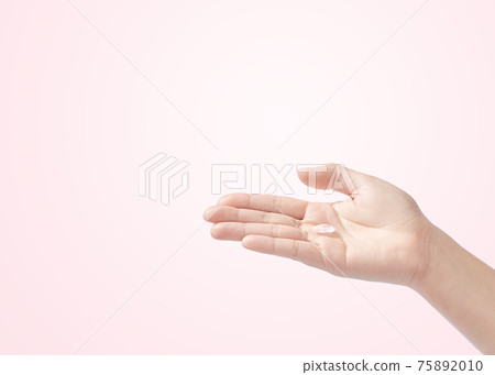 Cherry blossom petals on the palm 75892010