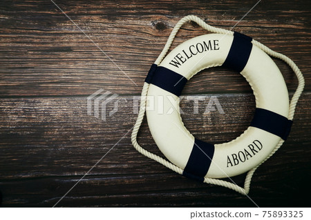 Lifebuoy Marine Decoration with space copy on wooden background 75893325