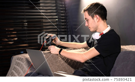 Young content creator man setting up the microphone 75893421