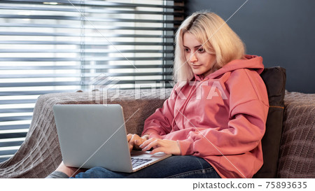 Young content creator girl is on her laptop 75893635