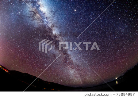 Fish-eye astrophotography of the Milky Way and starry sky seen in Tekapo, New Zealand 75894997