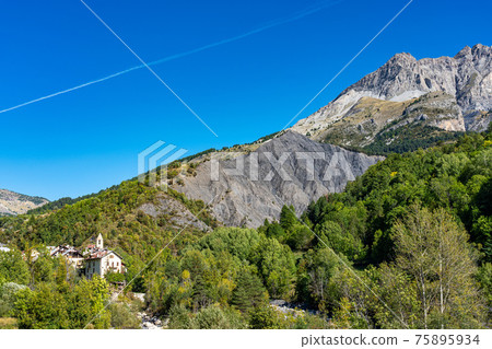Landscape view of Col de la Cayolle pass and surrounding mountains in France Landscape view of Col de la Cayolle pass and surrounding mountains in France 75895934
