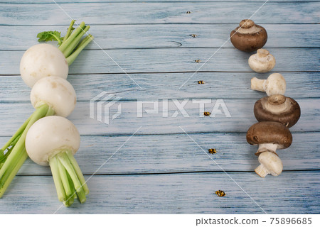 Fresh champignon mushrooms and on wooden table. Fresh champignon mushrooms and on wooden table. 75896685