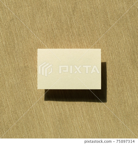 Blank memo pad, empty paper on fabric background. top view, copy space Blank memo pad, empty paper on fabric background. top view, copy space 75897314