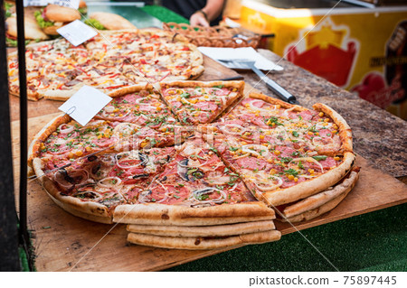 Closeup of pizza in street fast food cafe 75897445