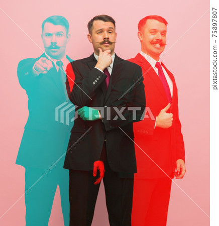 Young business man in black suit on pink background with glitch effect. 75897807