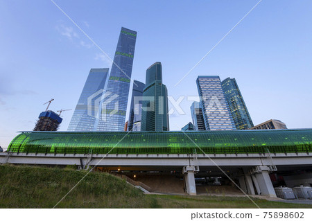 Moscow Central Circle (Little Ring, MCC,or MK MZD) and skyscrapers of the International Business Center (City) at night, Russia. Delovoy Tsentr  railway station 75898602