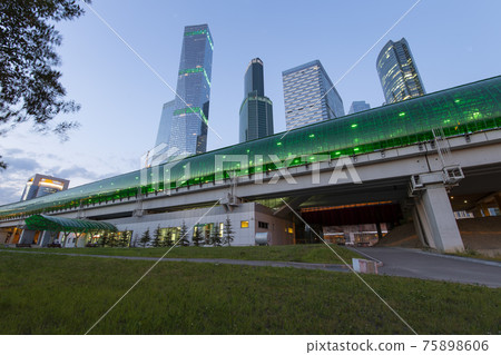 Moscow Central Circle (Little Ring, MCC,or MK MZD) and skyscrapers of the International Business Center (City) at night, Russia. Delovoy Tsentr railway station Moscow Central Circle (Little Ring, MCC,or MK MZD) and skyscrapers of the International Business Center (City) at night, Russia. Delovoy Tsentr railway station 75898606