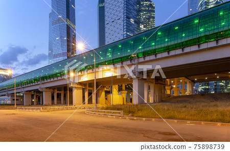 Moscow Central Circle (Little Ring, MCC,or MK MZD) and skyscrapers of the International Business Center (City) at night, Russia. Delovoy Tsentr railway station Moscow Central Circle (Little Ring, MCC,or MK MZD) and skyscrapers of the International Business Center (City) at night, Russia. Delovoy Tsentr railway station 75898739