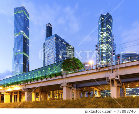 Moscow Central Circle (Little Ring, MCC,or MK MZD) and skyscrapers of the International Business Center (City) at night, Russia. Delovoy Tsentr railway station Moscow Central Circle (Little Ring, MCC,or MK MZD) and skyscrapers of the International Business Center (City) at night, Russia. Delovoy Tsentr railway station 75898740