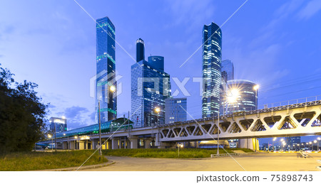 Moscow Central Circle (Little Ring, MCC,or MK MZD) and skyscrapers of the International Business Center (City) at night, Russia. Delovoy Tsentr  railway station 75898743