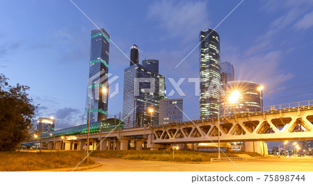 Moscow Central Circle (Little Ring, MCC,or MK MZD) and skyscrapers of the International Business Center (City) at night, Russia. Delovoy Tsentr railway station Moscow Central Circle (Little Ring, MCC,or MK MZD) and skyscrapers of the International Business Center (City) at night, Russia. Delovoy Tsentr railway station 75898744