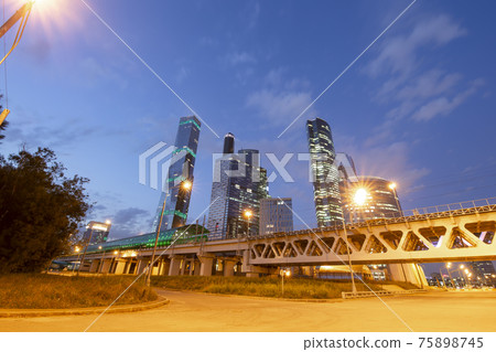 Moscow Central Circle (Little Ring, MCC,or MK MZD) and skyscrapers of the International Business Center (City) at night, Russia. Delovoy Tsentr  railway station 75898745