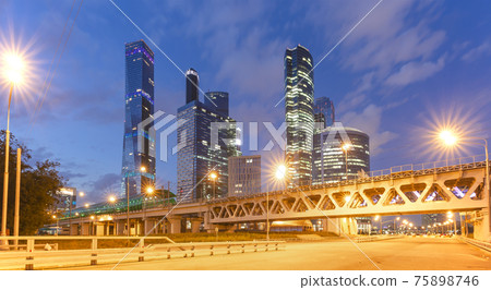 Moscow Central Circle (Little Ring, MCC,or MK MZD) and skyscrapers of the International Business Center (City) at night, Russia. Delovoy Tsentr  railway station 75898746