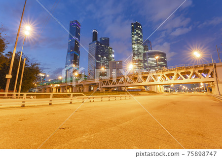 Moscow Central Circle (Little Ring, MCC,or MK MZD) and skyscrapers of the International Business Center (City) at night, Russia. Delovoy Tsentr  railway station 75898747