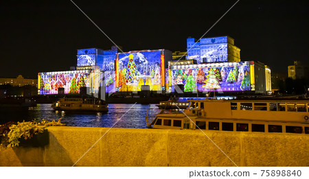 International Festival Circle of Light. Laser video mapping show on facade of the Ministry of Defense in Moscow, Russia 75898840