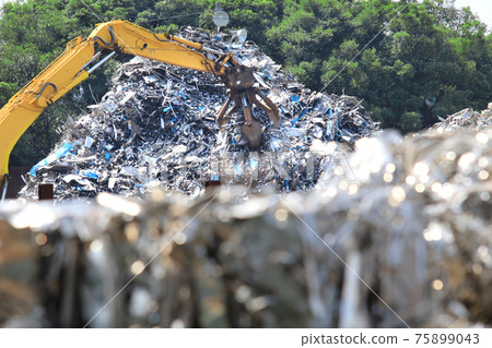 Cranes working with industrial waste of metals Cranes working with industrial waste of metals 75899043