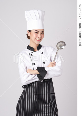 Beautiful young asian woman chef on white background. Beautiful young asian woman chef on white background. 75899870