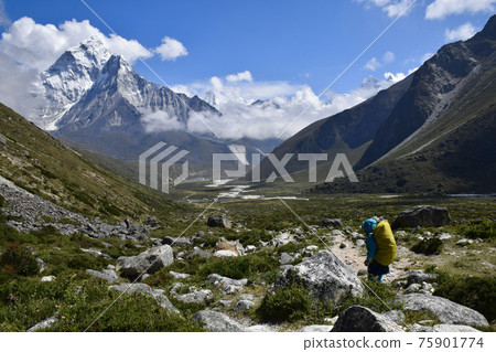 Trekkers with spectacular views from Perice to Tukra in Nepal 75901774