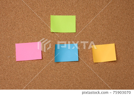 multicolored square sticks are glued to the brown cork texture multicolored square sticks are glued to the brown cork texture 75903070