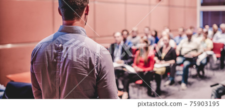 Speaker Giving a Talk at Business Conference and Presentation. 75903195