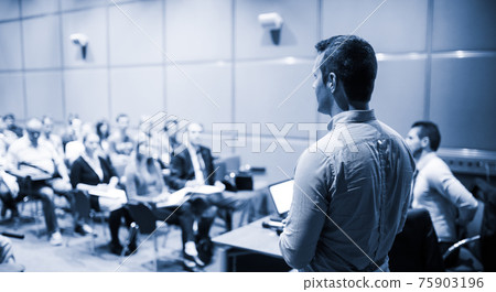 Speaker Giving a Talk at Business Conference and Presentation. 75903196