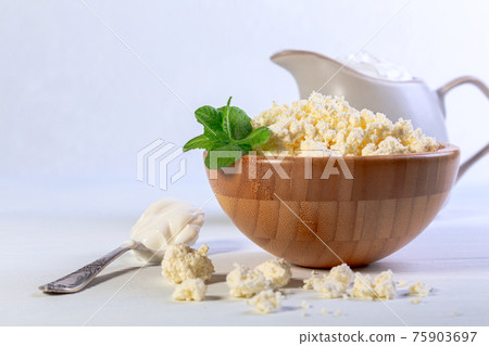 Cottage cheese with homemade sour cream. Cottage cheese with homemade sour cream. 75903697