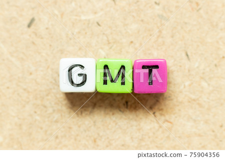 Color alphabet letter block in word GMT (abbreviation of Greenwich Mean Time) on wood background Color alphabet letter block in word GMT (abbreviation of Greenwich Mean Time) on wood background 75904356